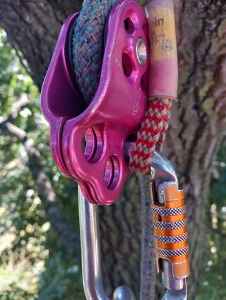 Close-up of rigging pulley and carabiner on climbing rope